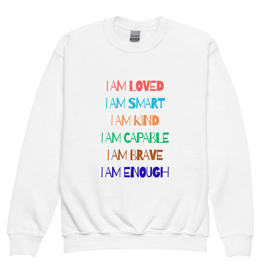 White graphic youth sweatshirt with uplifting words celebrating inclusion, special needs, and positive community support.